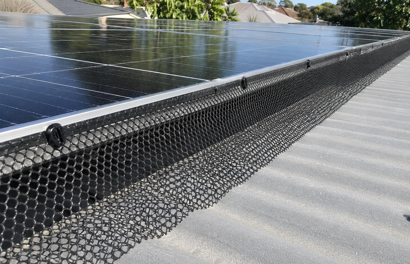 Solar panels on a roof fitted with bird proofing mesh